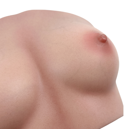 Realistic silicone breast with natural skin texture and detailed nipple, designed for intimate pleasure.