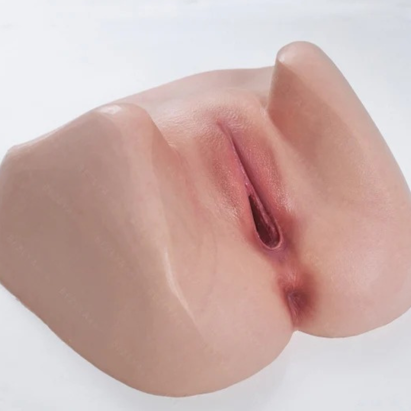 Realistic flesh-toned male masturbator with detailed labia and vaginal opening, smooth soft texture