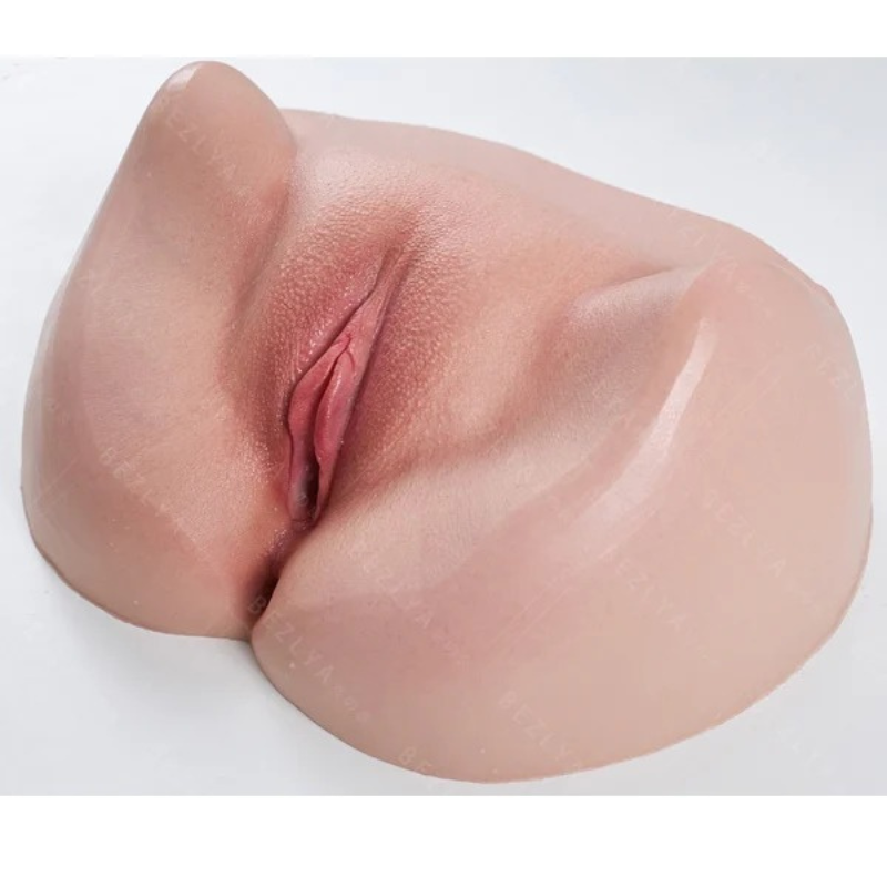Realistic male masturbator with lifelike skin texture, natural pink tones, and detailed vaginal opening for enhanced pleasure.