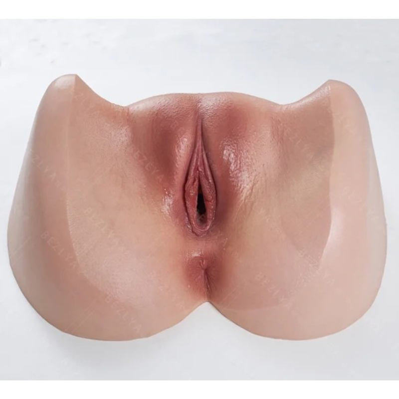 Realistic flesh-toned male masturbator with detailed labia and natural texture