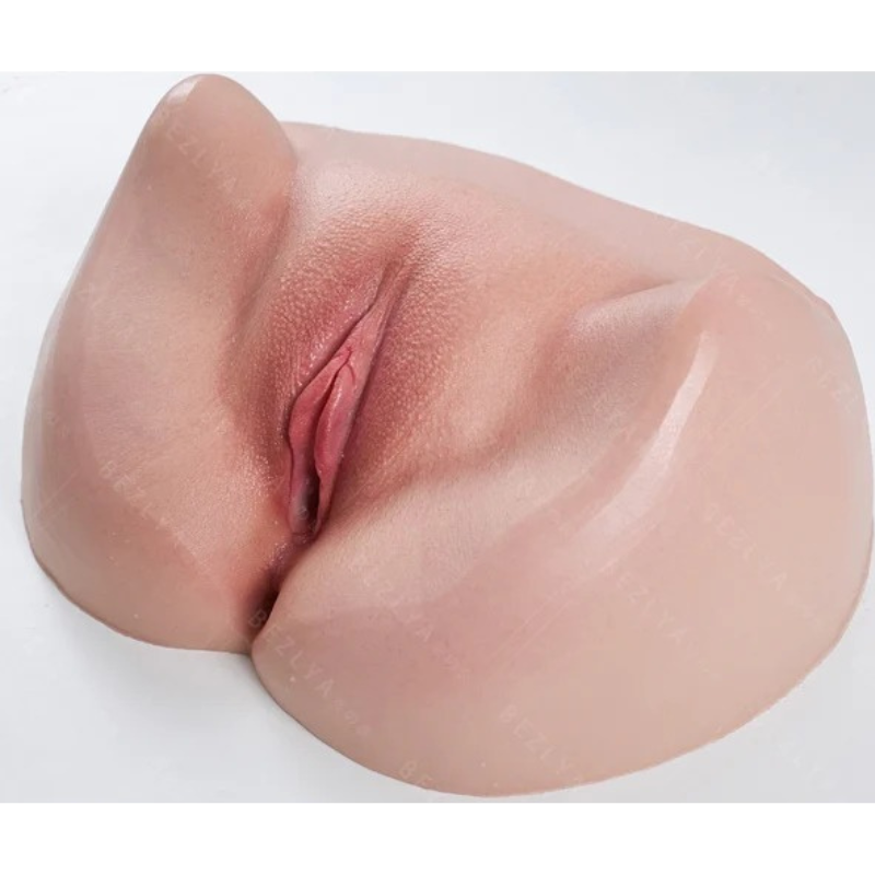 Realistic male masturbator with lifelike skin texture, natural pink tones, and detailed vaginal opening for intimate pleasure.