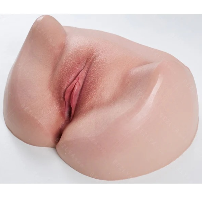 Realistic silicone male masturbator with detailed labia and natural skin texture