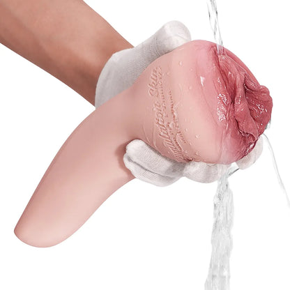 Realistic flesh-toned male masturbator with textured interior, being rinsed under water, held in gloved hand
