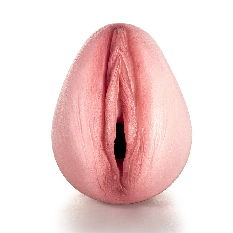 Realistic pink male masturbator with detailed labia and textured inner canal for enhanced pleasure.