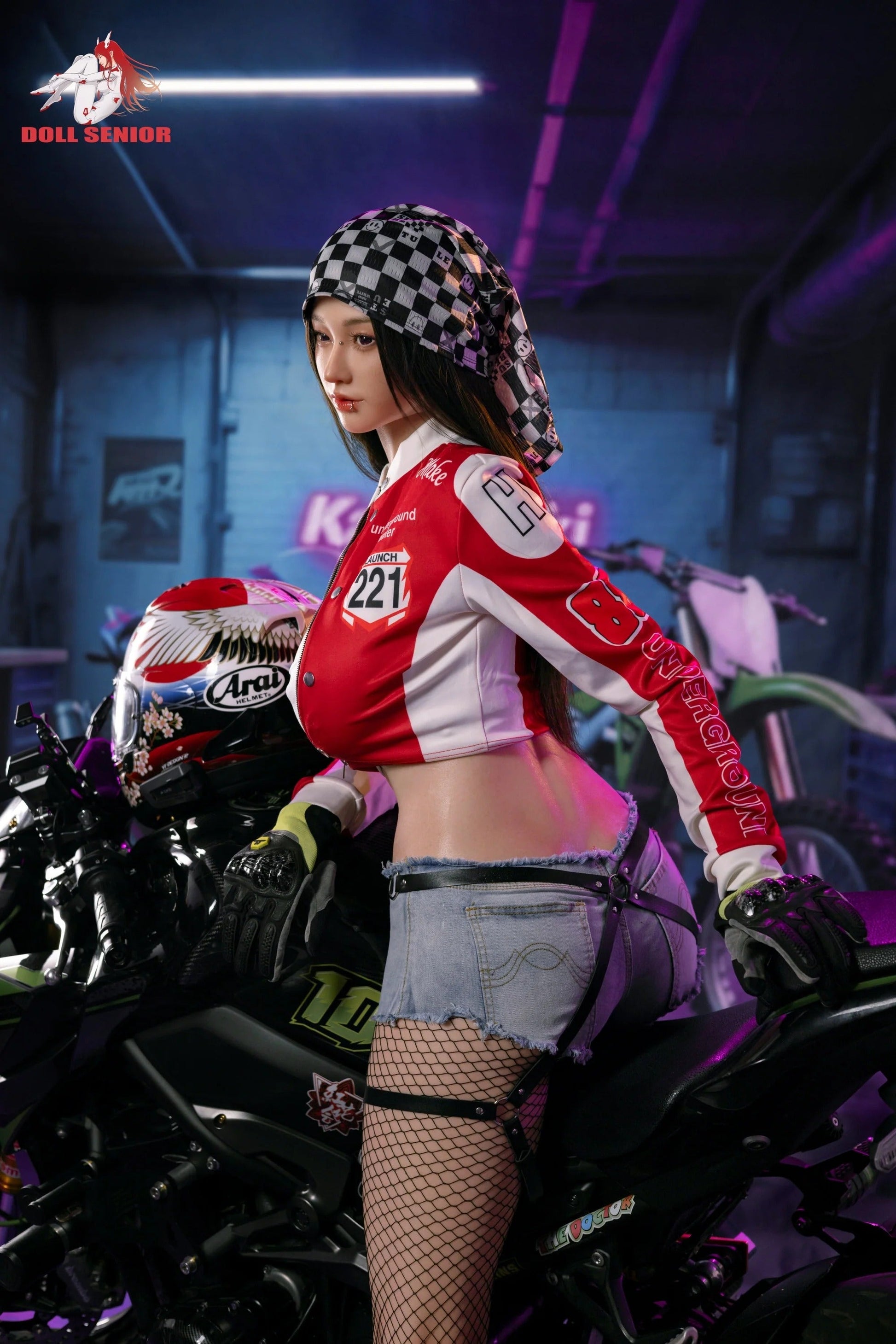 Realistic female doll in red racing jacket, denim shorts, fishnet stockings, leaning on motorcycle in neon-lit garage