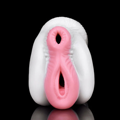 Realistic pink and white male masturbator with textured inner canal and soft silicone exterior