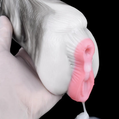 Realistic male masturbator with pink vaginal opening, smooth white exterior, and textured inner walls, held in gloved hand.
