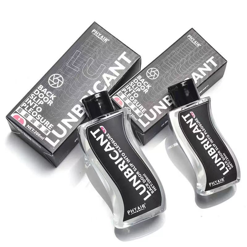 Clear 200ml lubricant bottles with black labels, sleek design, paired with matching boxes for intimate use.