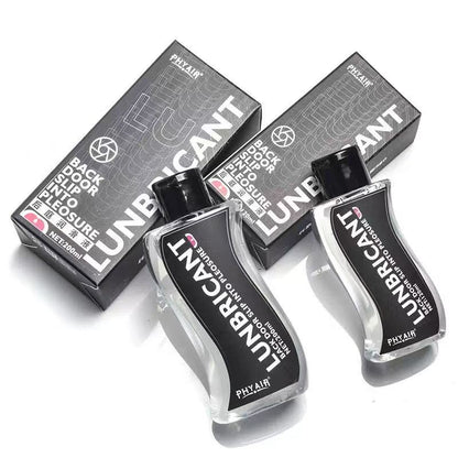 Clear 200ml lubricant bottles with black labels, sleek design, paired with matching boxes for intimate use.