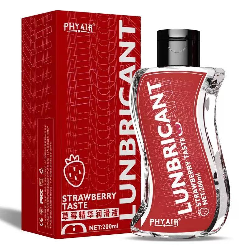 Strawberry-flavored lubricant in clear bottle with red label, 200ml, alongside matching red packaging