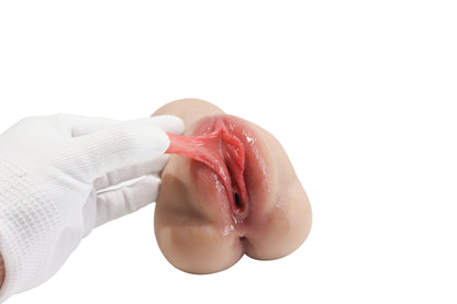 Realistic male masturbator with soft, stretchy pink interior and lifelike skin texture, held by gloved hand