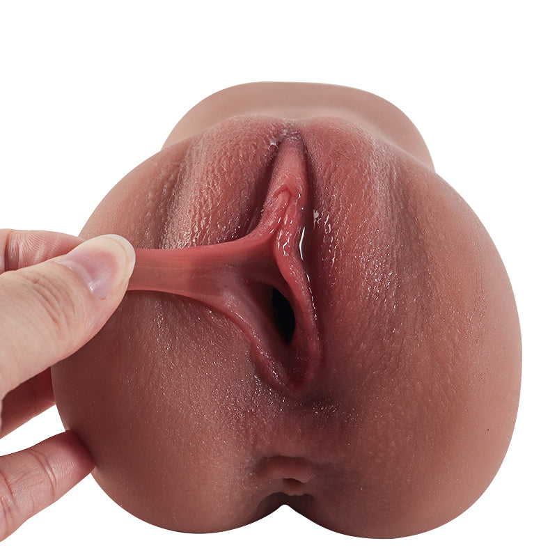 Realistic silicone male masturbator with detailed vaginal texture and natural skin tone, shown being gently stretched for flexibility.