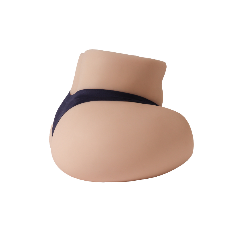 Realistic flesh-toned male masturbator with detailed labia and dark pubic texture, soft silicone material