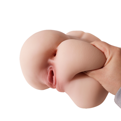 Realistic flesh-toned male masturbator with detailed labia and soft, pliable texture held in hand