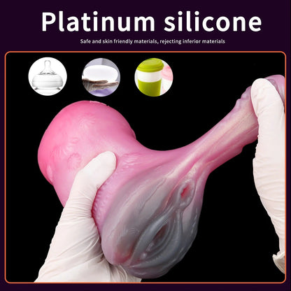Pink silicone male masturbator with realistic texture and flexible design, held in gloved hands