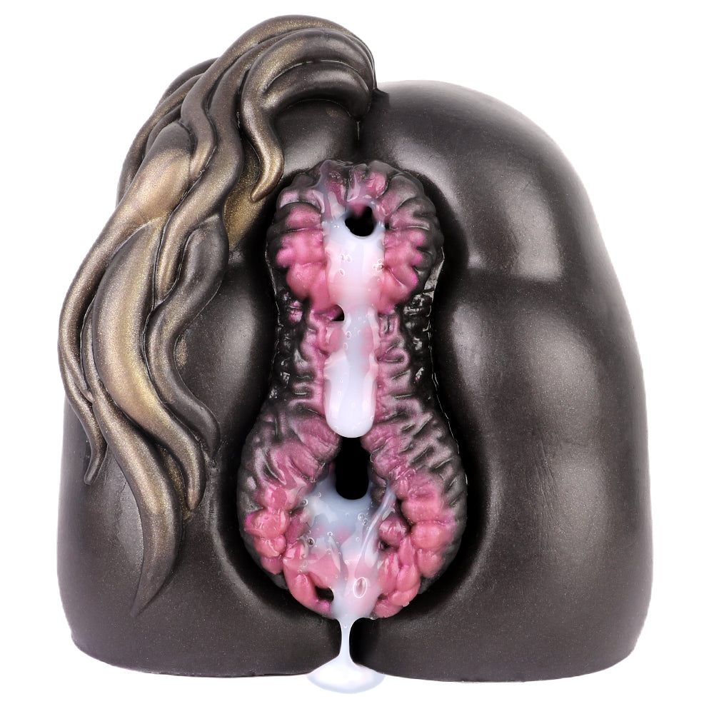 Realistic male masturbator with textured pink interior, black exterior, and gold hair detail, featuring dual openings.