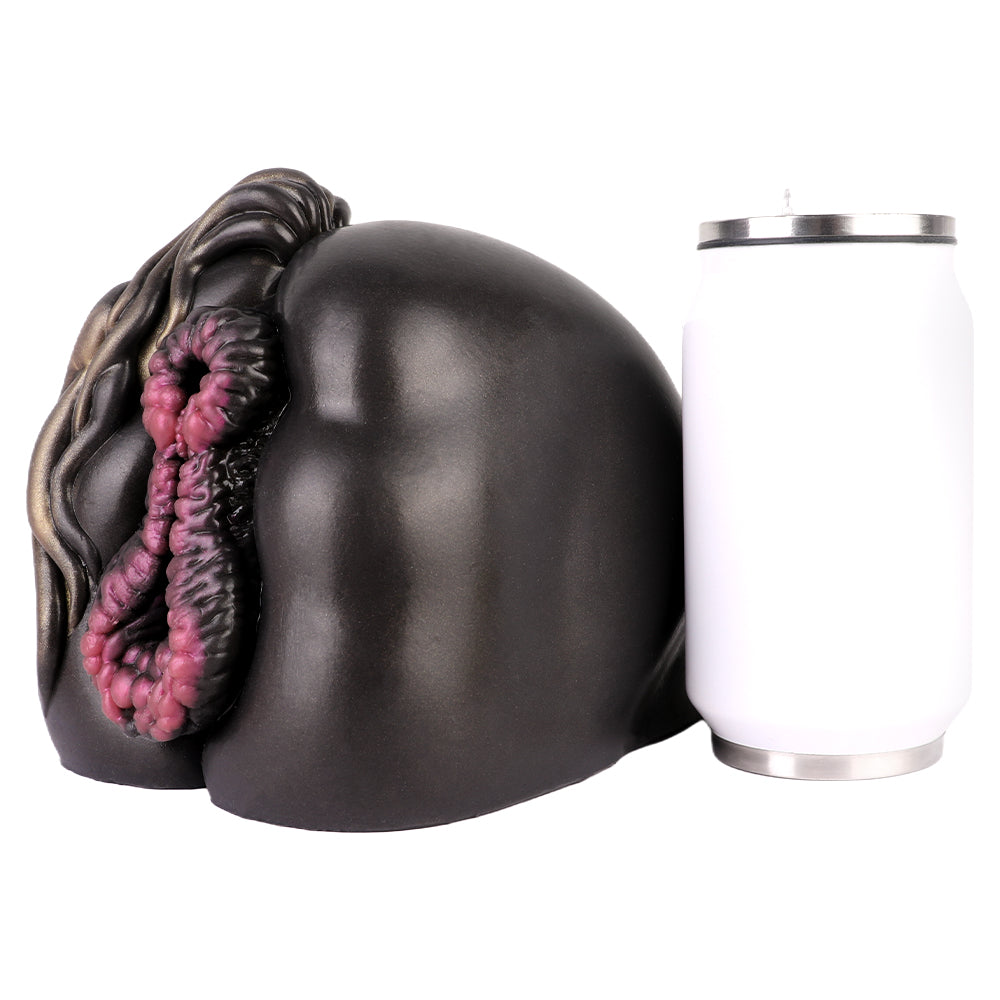 Realistic black male masturbator with detailed pink inner texture, shown beside a can for scale